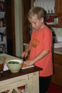 Safety in the kitchen. Kids can hold a knife as long as you teach them the right way!